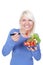 Attractive blond woman eats salat with tomato and mozarella