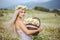 Attractive blonde in chamomile field. Young woman in wreath