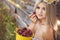 Attractive blonde in chamomile field. Young woman in wreath