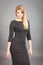 Attractive blonde woman wearing tight black dress