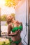 Attractive Blondie Young Woman In Green Bikini Is Taking Shower.