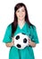 Attractive brunette doctor with soccer ball