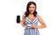 Attractive brunette girl in a striped dress with a neckline with a phone with mockup and credit card in her hands on a