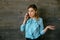 Attractive businesswoman looks confused while talking on mobile phone