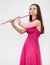 Attractive Caucasian woman a flutist playing on silver flute