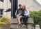 Attractive caucasian woman and her husband on vacation in front of the Seattle Art Museum in Seattle, Washington