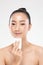 Attractive Charming Asian young woman smile and using tissue with toner for cleaning make up feeling so fresh and clean with healt