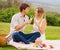 Attractive couple on romantic afternoon picnic