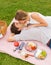 Attractive couple on romantic afternoon picnic kissing