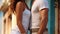 Attractive couple in white casual clothes, standing close to each other, feeling attracted. Generative AI