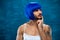 Attractive cross dressing male person in blue wig