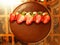 Attractive evening table,Delicious chocolate birthday cake with strawberry and cream pieces