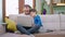 Attractive father with his son on the sofa speeding the time they using the laptop to watch a movie while stay at home