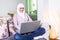 Attractive female Arabic working on laptop computer and paperwork`s on desk. Muslim Businesswoman working at home. Dedication and