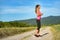 Attractive female runner holding headphones