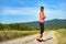 Attractive female runner holding headphones