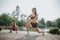 Attractive fit girls exercising outdoors in a green environment, inspiring a healthy lifestyle and fitness motivation.