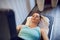 Attractive fit middle-aged woman doing vacuum therapy