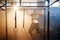 Attractive fitness guy doing pull-ups on the crossbar during training in the modern gym. Close up shot.