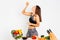 Attractive fitness woman, trained female Fit power athletic confident young woman bodybuilder eating orange, Organic Food.