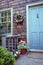 Attractive front entrance complements the cedar shake siding of this home.