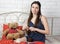 Attractive girl seamstress engaged in knitting on a bed