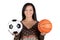 Attractive girl with soccer and basket ball