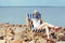 attractive girl in vintage swimsuit resting in beach chair