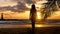 Attractive girl walking on sandy beach near palm tree branch with sea, sunset sun, lighthouse on background. Young woman