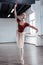 Attractive graceful ballerina dancing on one leg