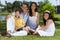 Attractive Happy Family Sitting Outside