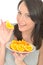 Attractive Happy Healthy Natural Young Woman Holding a Plate of Ripe Juicy Orange Segments