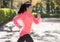 Attractive and happy runner woman in Autumn sportswear running a