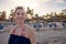 Attractive happy stylish woman on the beach