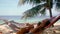 Attractive happy woman talking on cellphone and relaxing on hammock on tropical beach next to palm tree and beautiful