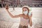 Attractive happy young woman with face mask taking a selfie. In COVID-19 New Normal and tourism