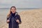 Attractive healthy woman enjoying a hike on the beach