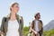 Attractive hiking couple walking on mountain trail