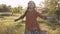 Attractive hippie woman with dreadlocks spinning and dancing slow motion 120fps. Sunset