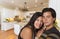 Attractive Hispanic Couple Inside Custom Kitchen Interior