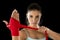 Attractive hispanic fitness woman doing self hand wraps before boxing or fighting workout