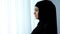 Attractive lady in hijab looking window, islamic obedience, waiting for husband