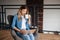 Attractive lady smiling while using her laptop and drinking coffee