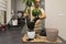 An attractive man transplanted an avocado seedling into a new, larger pot