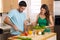 Attractive man and woman prepping low calorie dinner in kitchen very health conscious