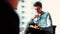 Attractive millennial young business man using tablet in the office