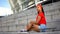 Attractive mixed-race girl with skateboard resting outdoor, waiting for friends