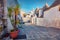 Attractive morning view of strret with trullo trulli -  traditional Apulian dry stone hut with a conical roof.