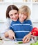 Attractive mother and her son cooking