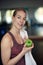 Attractive natural young woman athlete holding a fresh crisp green apple